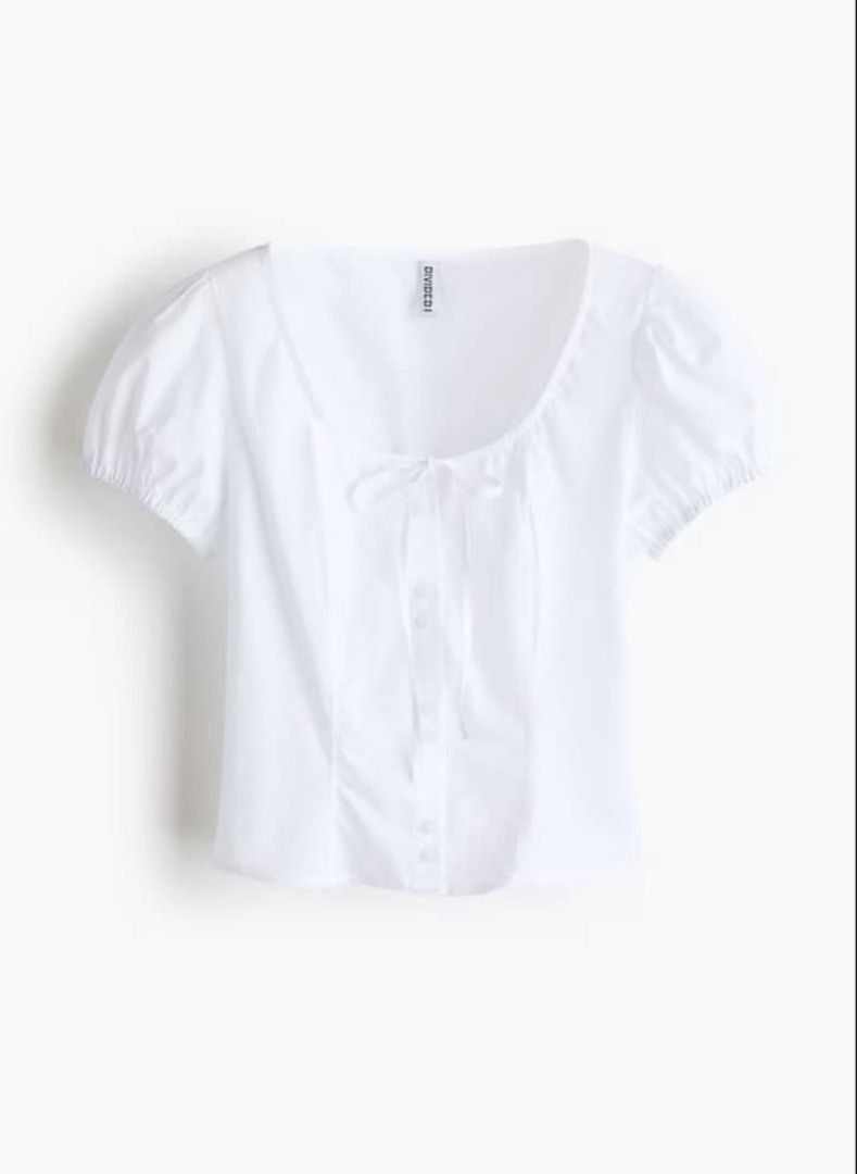 H&M White Puff Sleeve Bow Poplin Blouse (Category: Blouses) located in Cabuyao City. Submitted by butters123 (Listing ID 1469867706, Image 3). Description: - Brand: H&M Divided - Color: White - Style: Short sleeve cropped top with square neckline Rfs: too small on me.