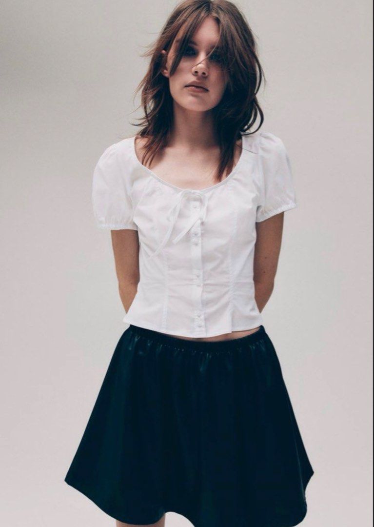 H&M White Puff Sleeve Bow Poplin Blouse (Category: Blouses) located in Cabuyao City. Submitted by butters123 (Listing ID 1469867706, Image 1). Description: - Brand: H&M Divided - Color: White - Style: Short sleeve cropped top with square neckline Rfs: too small on me.