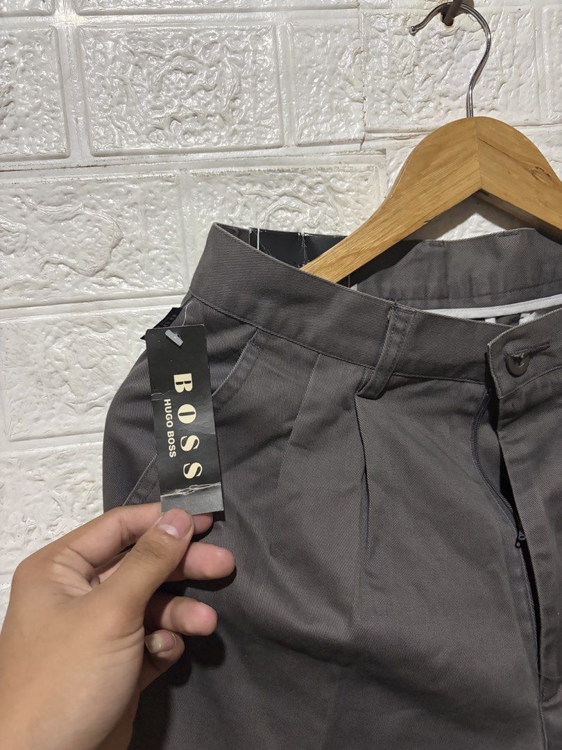 HUGO BOSS TROUSER PANTS (Category: Jeans) located in Quezon City. Submitted by chraliskyutie (Listing ID 1469869943, Image 3). Description: waist 28 to 29 Length 44 bnew with tag no issue medyo hard trouser siya .