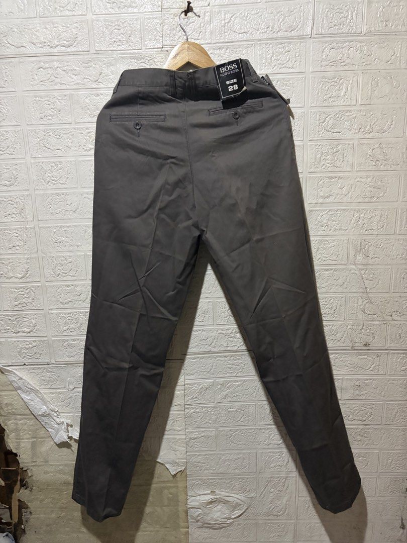 HUGO BOSS TROUSER PANTS (Category: Jeans) located in Quezon City. Submitted by chraliskyutie (Listing ID 1469869943, Image 1). Description: waist 28 to 29 Length 44 bnew with tag no issue medyo hard trouser siya .
