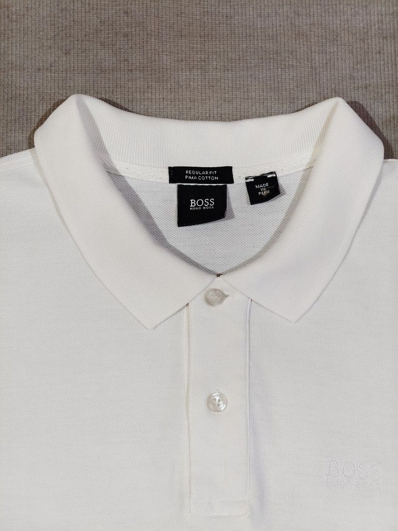 HUGO BOSS WHITE (Category: Tshirts & Polo Shirts ) located in Baliuag. Submitted by vk_thrift01 (Listing ID 1469913219, Image 3). Description: HUGO BOSS WHITE DIMES: 17 X 26.5 CONDI: EXCELLENT CONDITION COLOR RATE: 9.7/10 ISSUE: REPAIRED PINHOLE AND BURADO NA ANG WASHTAG PRICE: 750 NOTE: ‼️‼️‼️ 📌ALL ITEMS ARE THRIFTED NOT BRANDNEW SO KINDLY MANAGE YOUR EXPECTATIONS. 📌ALL ITEMS ARE NEEDS WASH 📌COLOR MAY SLIGHTLY DIFFER DUE TO LIGHTING CONDITION
