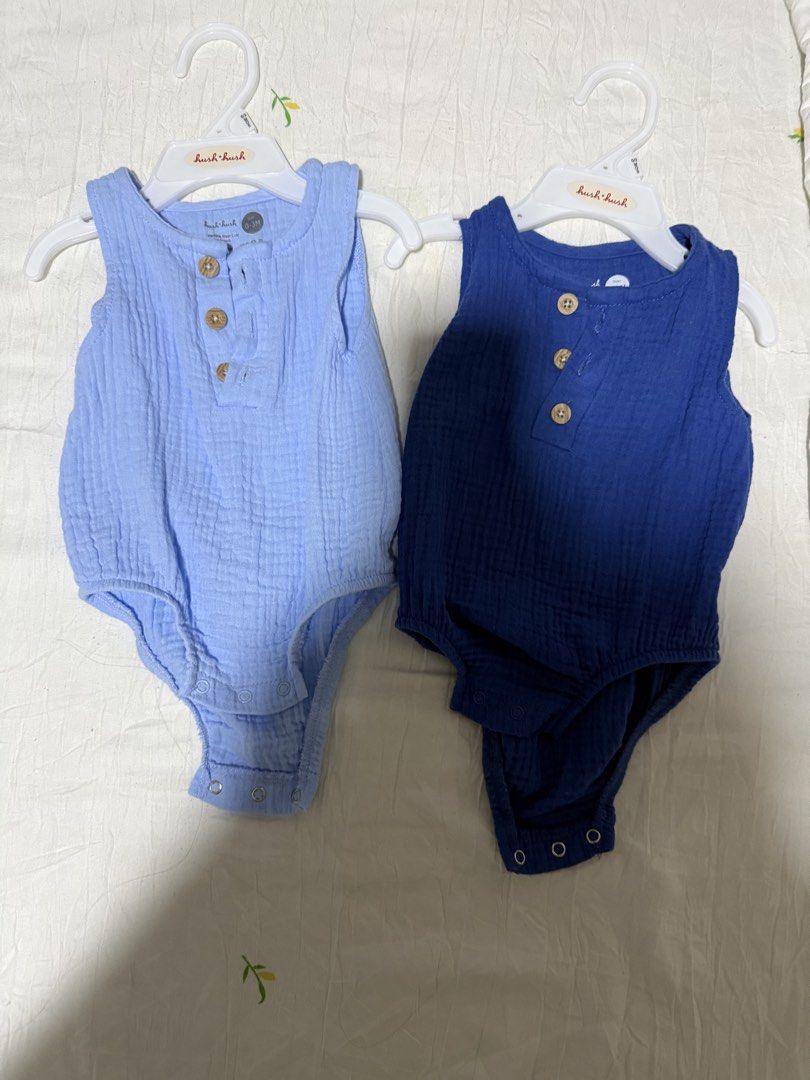 Hush Hush Baby boy Rompers Set (2 pieces) (Category: Babies & Kids Fashion) located in Batangas. Submitted by sssyychic (Listing ID 1469876849, Image 1). Description: - Brand: Hush Hush - Size: 0-3 months - Quantity: 2 pieces (Light blue and dark royal blue) - Condition: Brand new with hang tags attached - Material: Soft muslin cotton, lightweight and breathable for warm weather - Design: Sleeveless, cute wooden buttons in front, and bottom snap 
