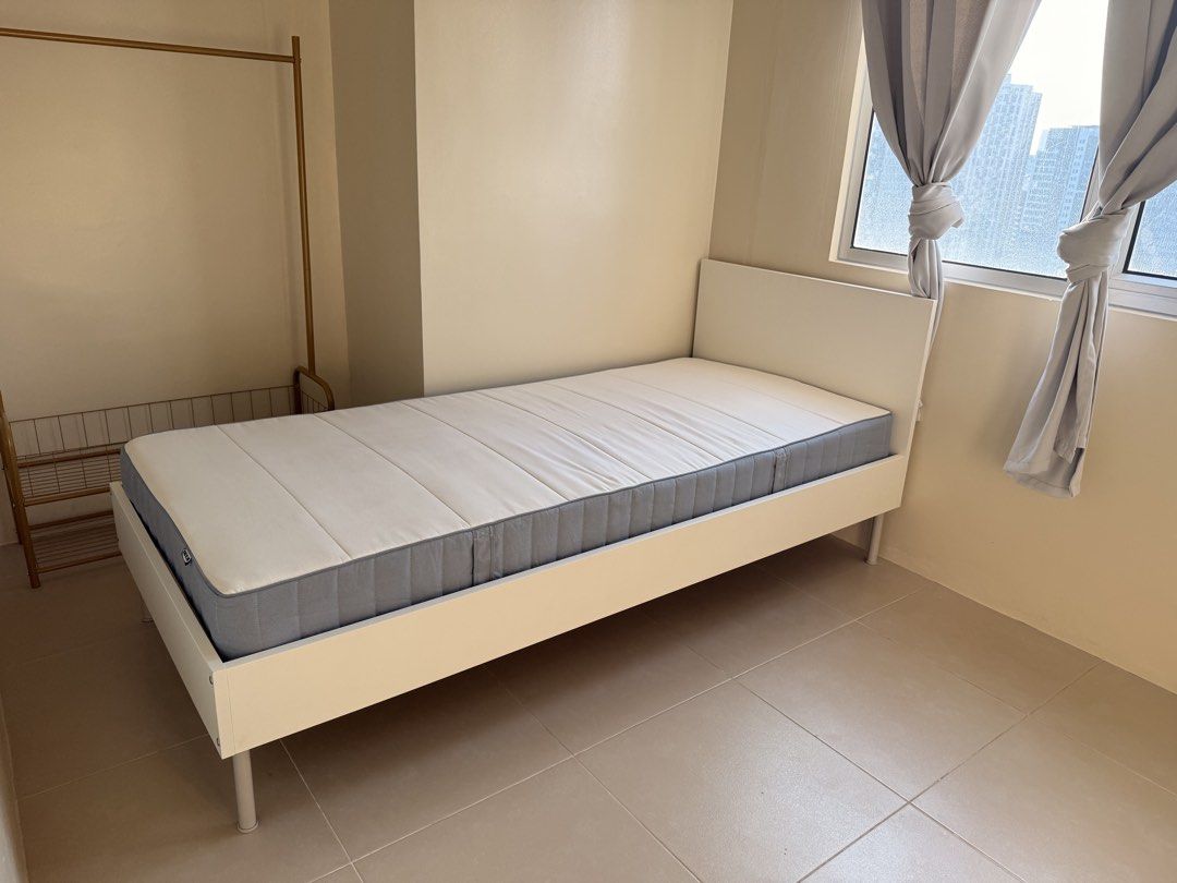 IKEA Bed Frame White Single (Category: Bed Frames & Mattresses) located in Quezon City. Submitted by keenflower_35e25a (Listing ID 1469819441, Image 1). Description: - IKEA BRUKSVARA single bed frame in white - Dimensions: 90x200 cm (fits standard single mattresses) - Clean, minimalist design featuring a stylish tall headboard - Includes sturdy wooden slats for solid mattress support - Neutral white finish that matches any room setup - Fulfillmen