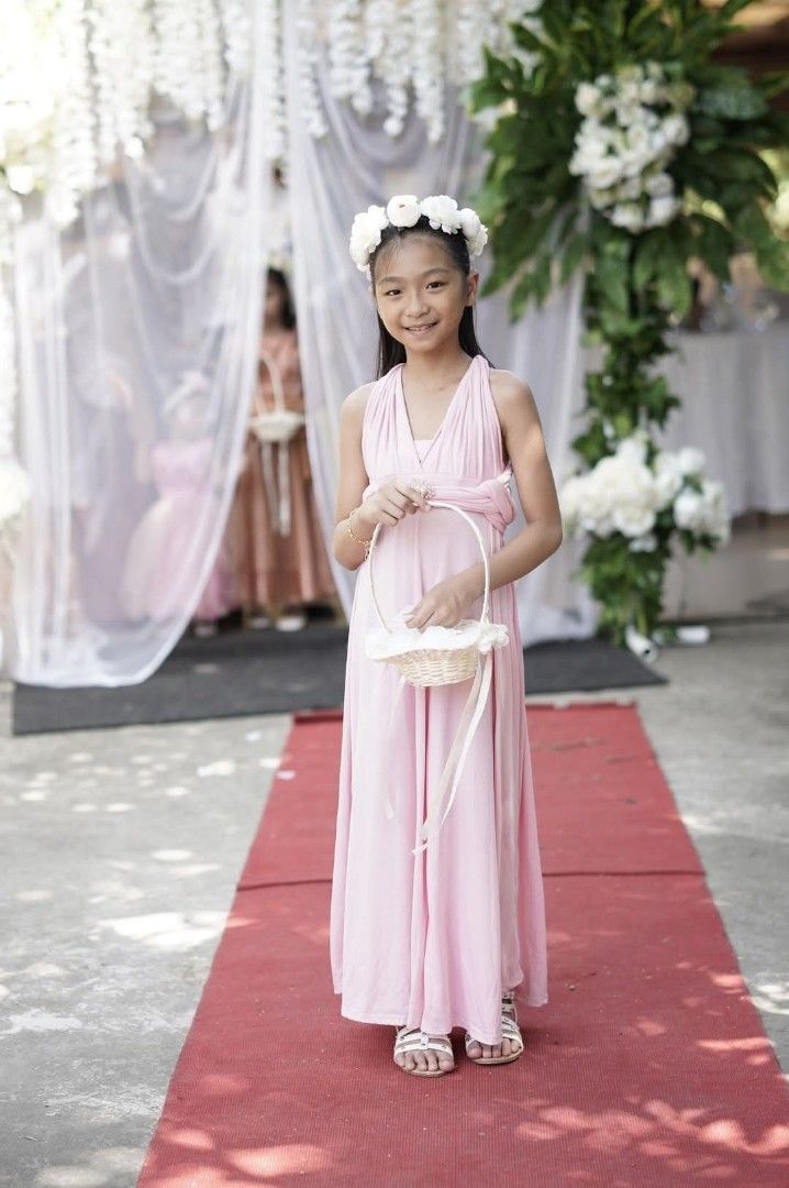 Infinity dress for kids (Category: Babies & Kids Fashion) located in Manila. Submitted by jhay27decluttering (Listing ID 1469845948, Image 1). Description: PLEASE READ THE DESCRIPTIONS 🙋🙋 -Price: 130 pesos each dress - Color: Light pink / pastel pink and Maroon - Style: Convertible maxi dress (multiple styling options with adjustable straps) -Size: Full length (estimation from 9 yrs old; hence, the child in the photo was 9 years old) Still depe