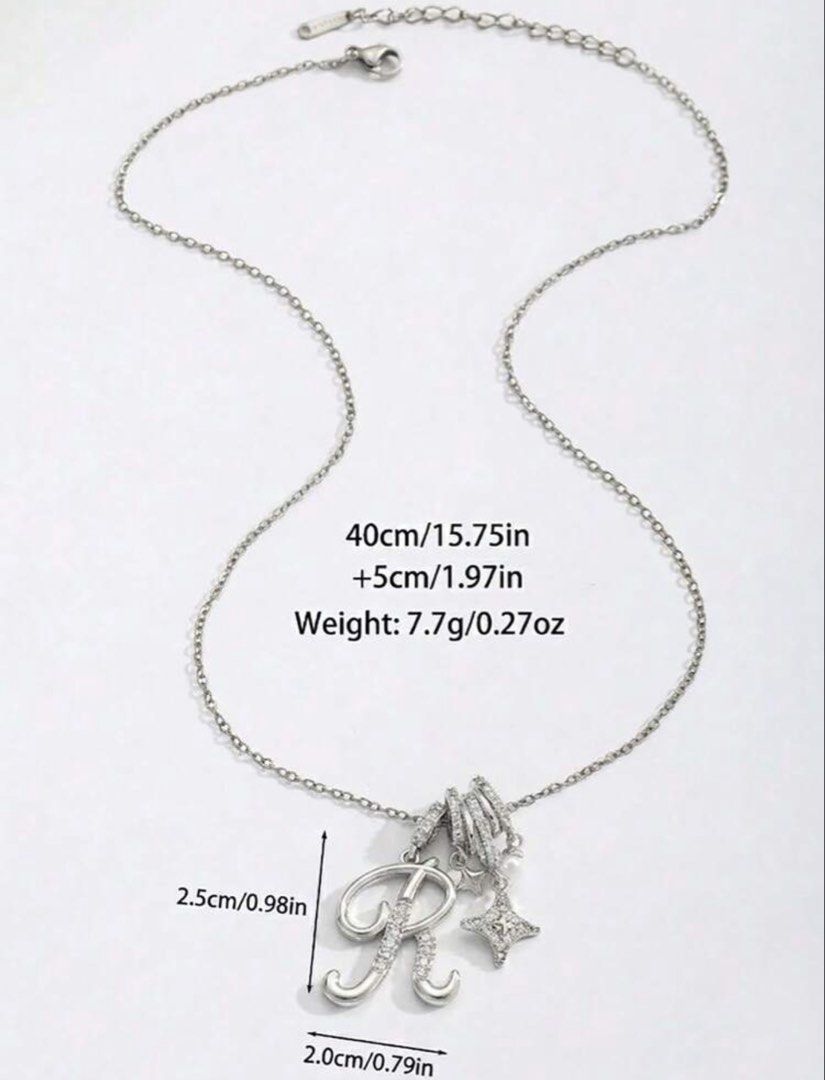 Initial R Rhinestone Pendant Necklace Silver (Category: Necklaces) located in Cainta. Submitted by buy.preloved (Listing ID 1469784773, Image 2). Description: - Silver-tone chain necklace with letter R pendant - Features sparkly rhinestones, a cute star charm, and a mini pearl accent - Chain length: 40cm with a 5cm extender - Pendant size: approx. 2cm x 2.5cm - Lightweight and comfortable at only 7.7g - Other letters available upon request from t