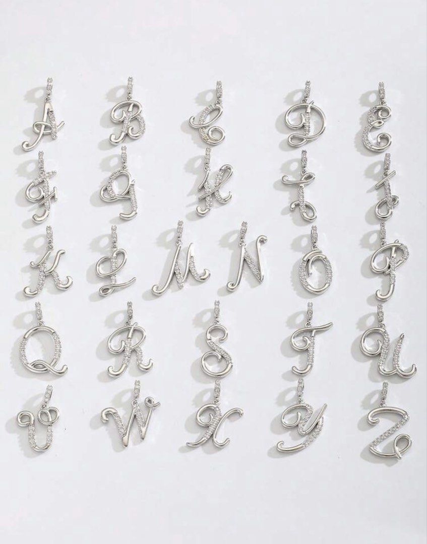 Initial R Rhinestone Pendant Necklace Silver (Category: Necklaces) located in Cainta. Submitted by buy.preloved (Listing ID 1469784773, Image 3). Description: - Silver-tone chain necklace with letter R pendant - Features sparkly rhinestones, a cute star charm, and a mini pearl accent - Chain length: 40cm with a 5cm extender - Pendant size: approx. 2cm x 2.5cm - Lightweight and comfortable at only 7.7g - Other letters available upon request from t