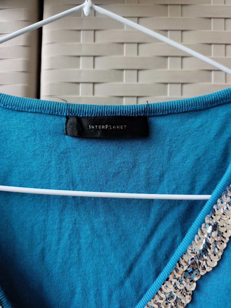 Interplanet Blue Sequined Tank Top (Category: Sleeveless) located in Cabanatuan. Submitted by lyxyx (Listing ID 1469900343, Image 2). Description: - Brand: Interplanet - Color: Bright blue with sparkling silver sequins - Style: Sleeveless V-neck tank top with ribbed knit material and slight ruching - Vibe: Authentic Y2K fashion, perfect for parties and nights out - Condition: Excellent pre-loved condition - Shipping: Ships fast from the Philippin