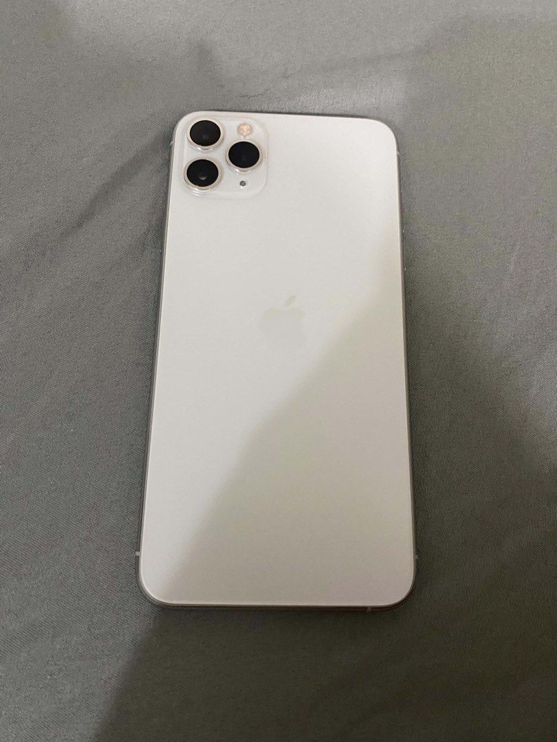 Iphone 11 Pro max (Category: iPhone 11 Series) located in Manila. Submitted by fast.cyrillemedina (Listing ID 1469890360, Image 1). Description: iPhone 11 Pro Max (white ) For sale and swap to lower unit +cash (swapping price is higher) 256GB 76% BH | Original Face ID working Truetone working No sim restrictions Never been repaired All parts still original ZP/A variant | NTC Approved Unit and 15pcs Case Manila, meetup near me.