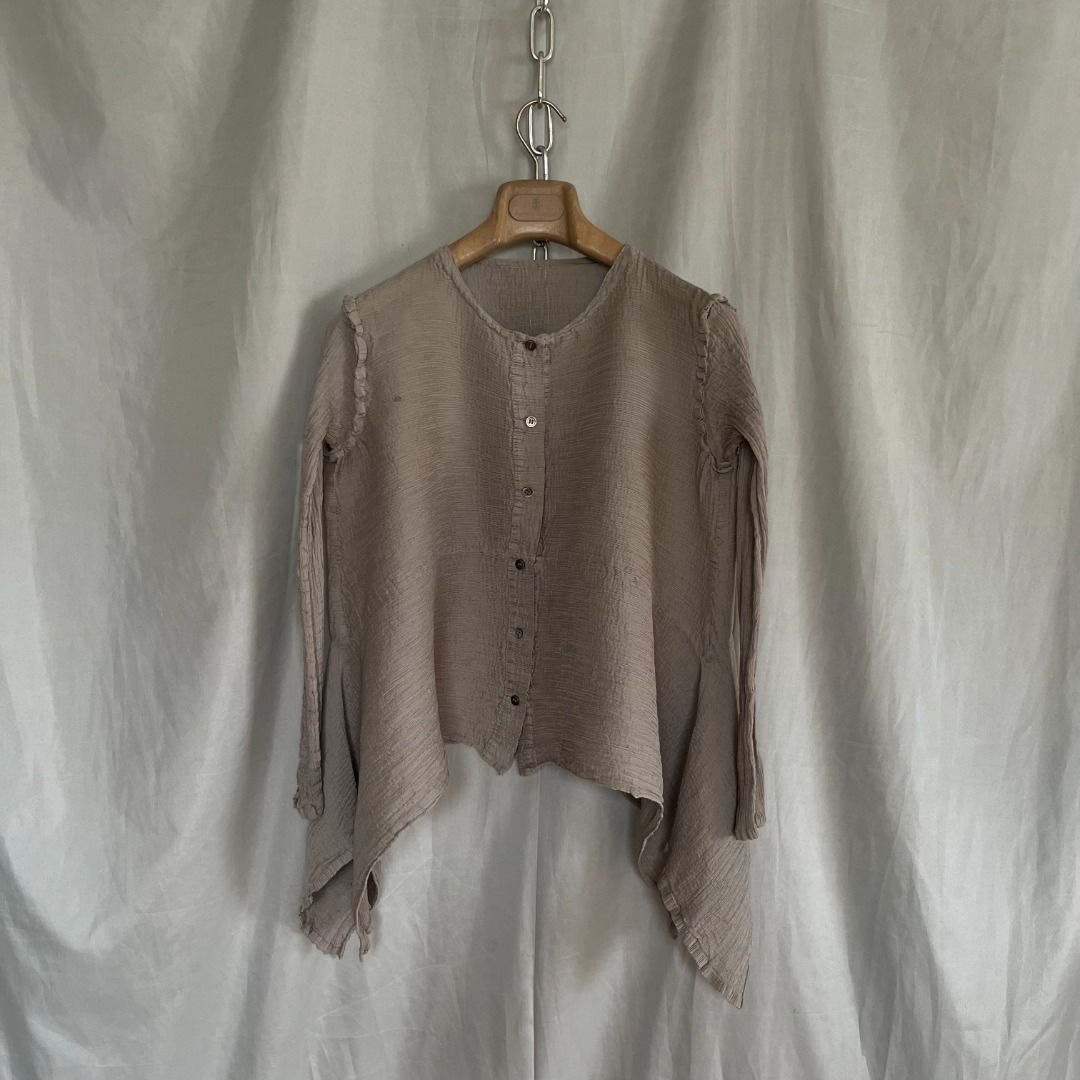 Issey Miyake Me Asymmetircal Top (Category: Longsleeves) located in Quezon. Submitted by _babypluto (Listing ID 1469851843, Image 1). Description: Tagged size: NA Condition: very good condition Flaw: stain Measurements: Width: 17 Length: 22 Sleeve Length: 20.5 Note: actual color of the item may change due to lighting .