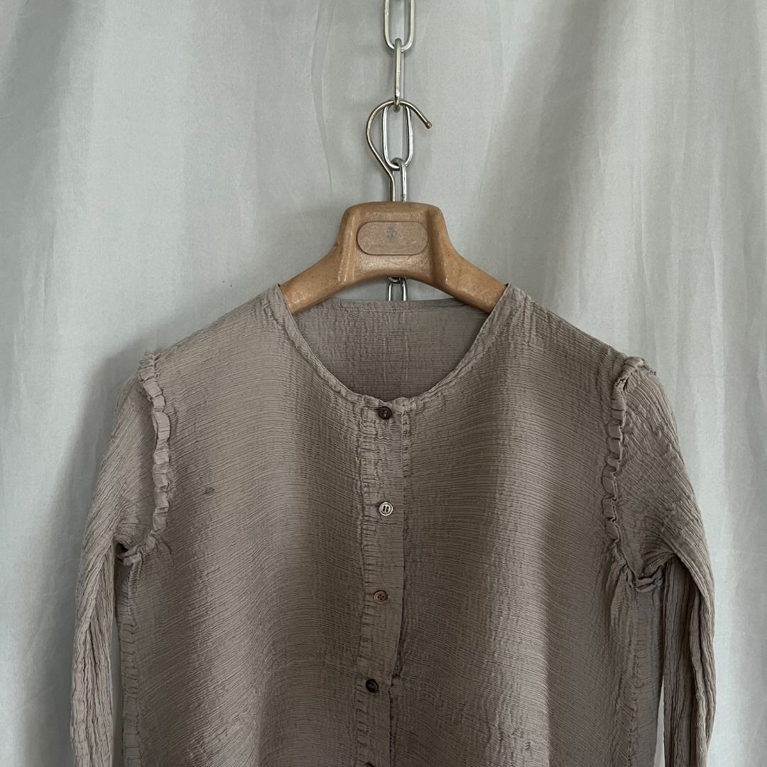 Issey Miyake Me Asymmetircal Top (Category: Longsleeves) located in Quezon. Submitted by _babypluto (Listing ID 1469851843, Image 2). Description: Tagged size: NA Condition: very good condition Flaw: stain Measurements: Width: 17 Length: 22 Sleeve Length: 20.5 Note: actual color of the item may change due to lighting .