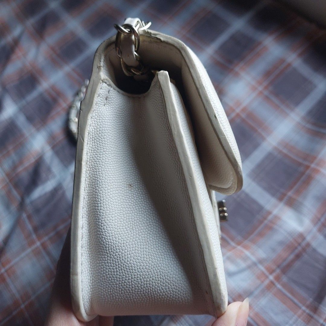 Jaod White Quilted Shoulder Bag with Gold Chain (Category: Shoulder Bags) located in Manila. Submitted by youresovaiineee (Listing ID 1469846850, Image 3). Description: - Material: White quilted faux leather with a structured, sturdy shape - Strap: Gold chain strap intertwined with white material - Closure: Secure front flap with a twist lock - Interior: Clean compartments lined in red with a convenient zipper pocket - Condition: Excellent and we