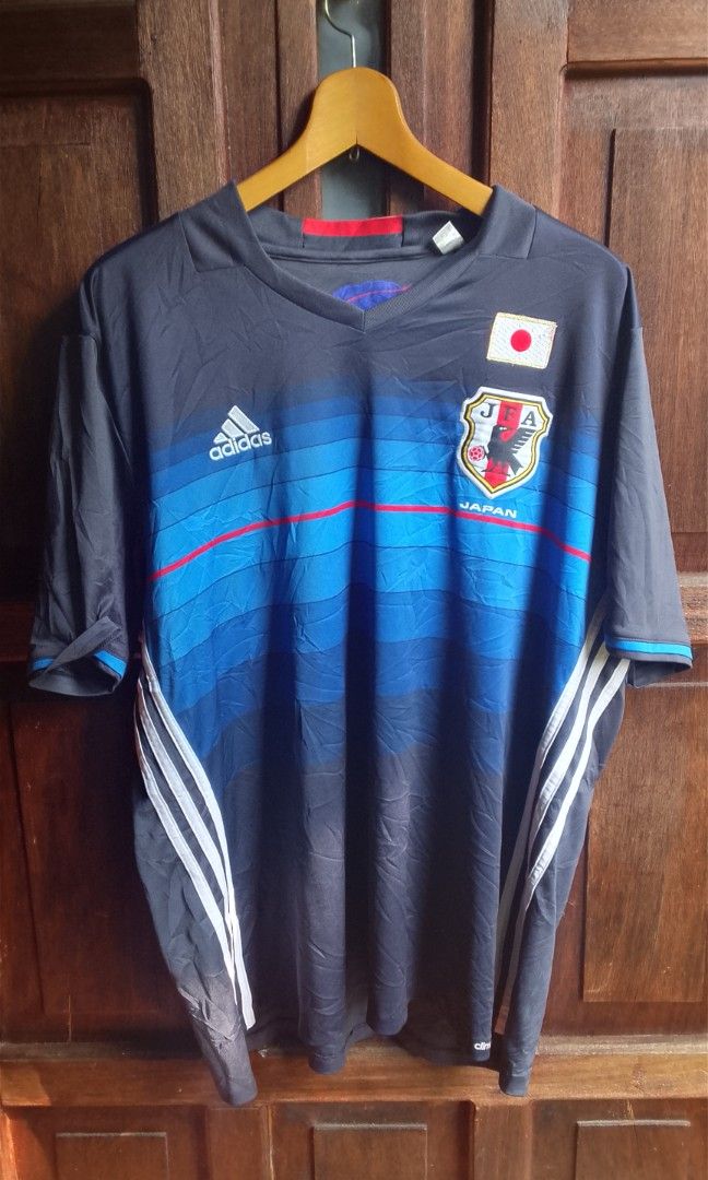 Japan National Team Jersey (Category: Formal Shirts) located in Manila. Submitted by plong7 (Listing ID 1469759993, Image 1). Description: - Brand: adidas - Team: Japan National Football Team (JFA — Japan Football Association) - Year/Edition: 2016–2017 Home Jersey - Fabric: adidas climacool — lightweight, breathable, moisture-wicking - Design: Dark navy base with gradient blue wave pattern, red accent line, Japan flag on chest, JFA crest, classic