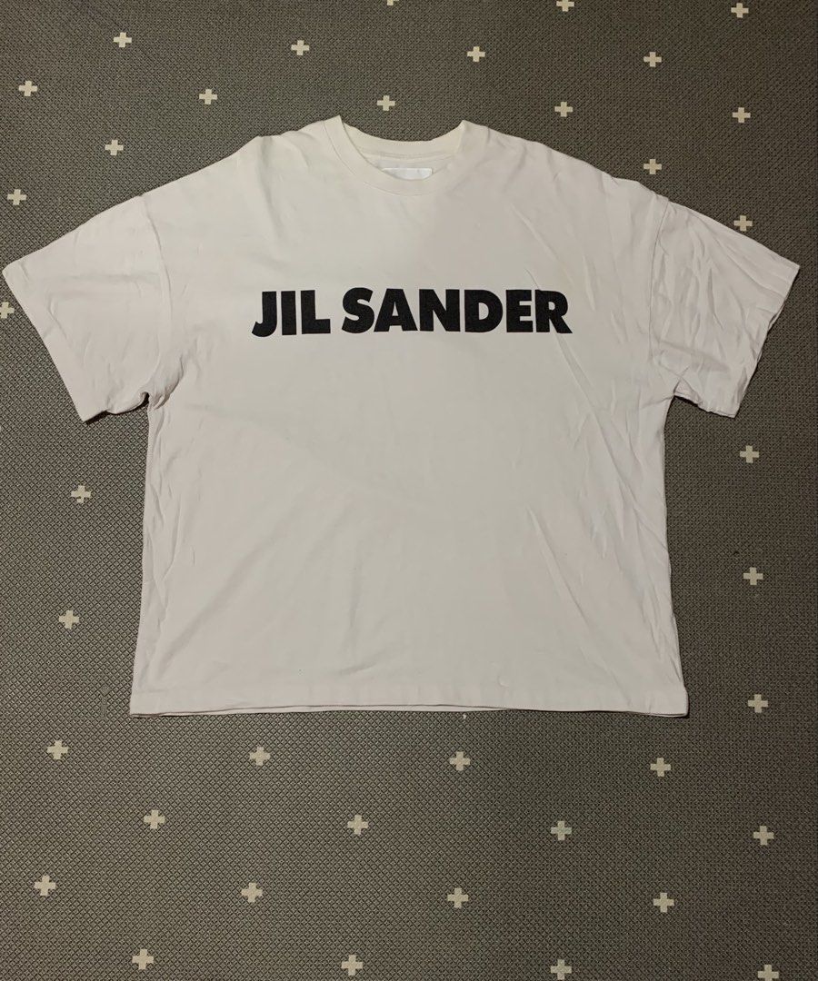 Jil Sander Logo Print Tee (Category: Tshirts & Polo Shirts ) located in Talisay. Submitted by psycho011288 (Listing ID 1469862918, Image 1). Description: 📍JIL SANDER LOGO PRINT TEE 📍💯AUTHENTIC / ORIG 📍Size small on tag ( oversized ) ( In actual dimension ) 📍WIDTH: 24” 📍LENGTH: 30” 📍EXCELLENT USED CONDITION 📍ACTUAL COLOR: White 📍COLOR RATE: 9.8/10 ❌NO ANY ISSUE❌ .
