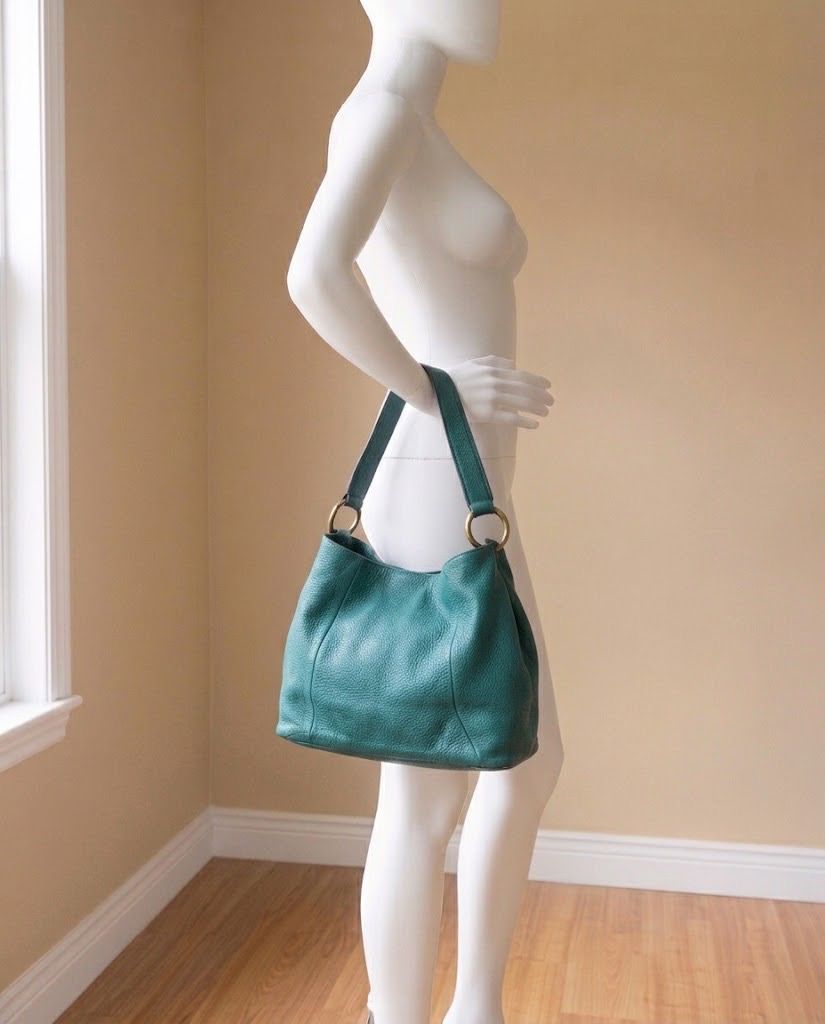 JILL SCOTT TEAL BLUE TOTE LEATHER BAG (Category: Tote Bags) located in Marikina City. Submitted by minimalistmanila (Listing ID 1469906019, Image 1). Description: Genuine Jill Scott pebbled leather teal blue bag. Medium roomy size. Bought abroad. In good condition with bottom rubbings. Can be painted on at leather shop. Inside has stains on inner cloth but can be cleaned as not used in a while. Order now! .