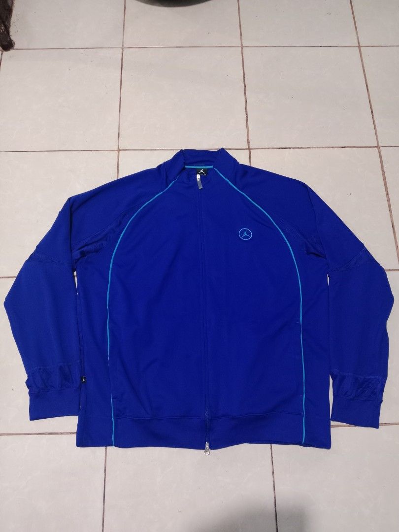 Jordan Dri-Fit Track Jacket Blue XXL (Category: Coats, Jackets and Outerwear) located in Bacolod City. Submitted by jorengrate26639 (Listing ID 1469892022, Image 1). Description: - Brand: Jordan - Style: Track Jacket (Style Code: 404341-409) - Color: Royal Blue with Turquoise Piping - Size: XXL (Regular Fit) - Material: Dri-Fit fabric technology for moisture-wicking comfort - Design: Full zip front, mock neck, ribbed cuffs and hem - Branding: Ico