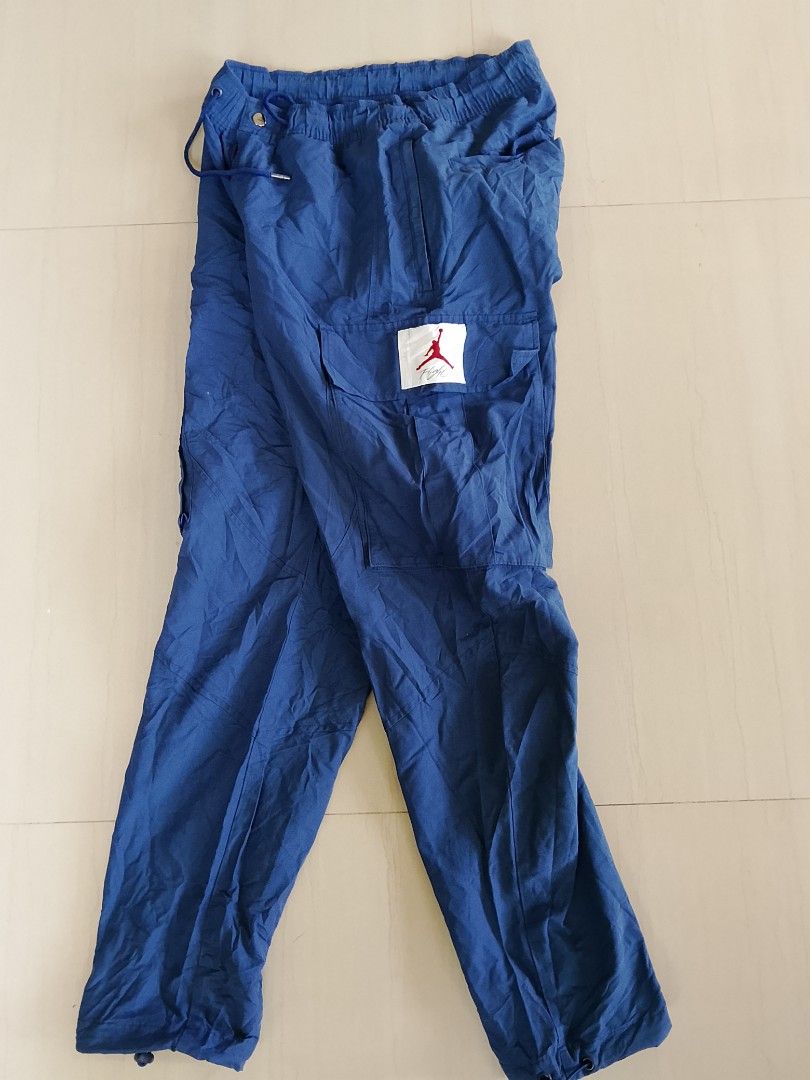 Jordan Flight Cargo Pants Blue Size S (Category: Joggers) located in Manila. Submitted by arjaygoodfind (Listing ID 1469832015, Image 2). Description: - Brand/Model: Jordan Flight Cargo Pants (Style: CV3178-492) - Color: Blue - Size: Small (Waist: 75cm) - Material: 58% cotton, 42% nylon - Fit: Standard fit with elastic drawstring waistband - Details: Bungee cord adjusters at cuffs, large utility thigh pockets, and Jordan Flight logo patch.