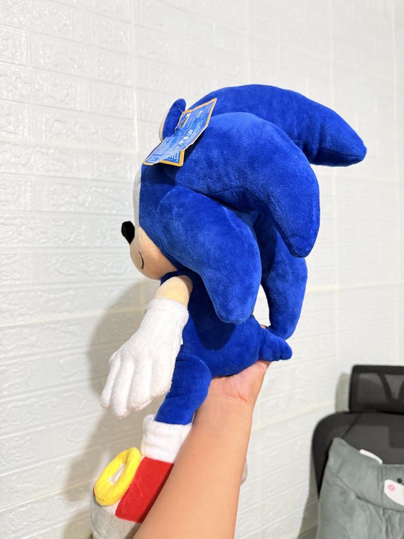 Jumbo Sonic the Hedgehog Plush (Category: Plushies & Soft Toys) located in Cavite. Submitted by projectplushie (Listing ID 1469849781, Image 2). Description: - Large Sonic the Hedgehog plush toy in classic blue - Features bright green embroidered eyes, white gloves, and red sneakers - Soft fabric body with detailed quill spikes on the back - Original tag still attached to the ear -Perfect for collection, display, or gifting.