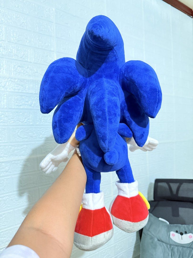 Jumbo Sonic the Hedgehog Plush (Category: Plushies & Soft Toys) located in Cavite. Submitted by projectplushie (Listing ID 1469849781, Image 3). Description: - Large Sonic the Hedgehog plush toy in classic blue - Features bright green embroidered eyes, white gloves, and red sneakers - Soft fabric body with detailed quill spikes on the back - Original tag still attached to the ear -Perfect for collection, display, or gifting.