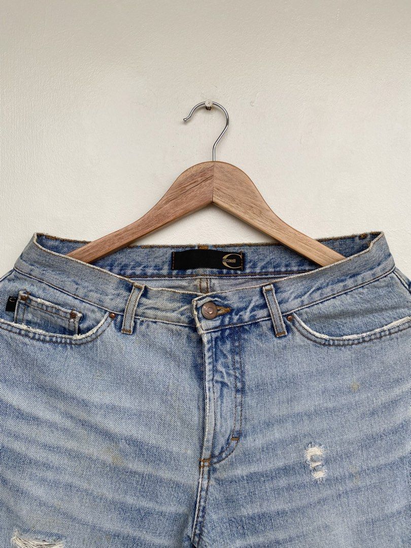 Just Cavalli 2000s Distressed Denim Jeans (Category: Jeans) located in Iloilo. Submitted by fukurou.vision (Listing ID 1469832985, Image 2). Description: Just Cavalli 2000s Distressed Denim Jeans Dimensions are in inches Waist - 28 Length - 41 Leg opening - 8.5 These denim jeans hail from Roberto Cavalli’s diffusion line Just Cavalli, launched in the late 1990s and defining early 2000s Italian denim flair. Produced under license by renowned Itali