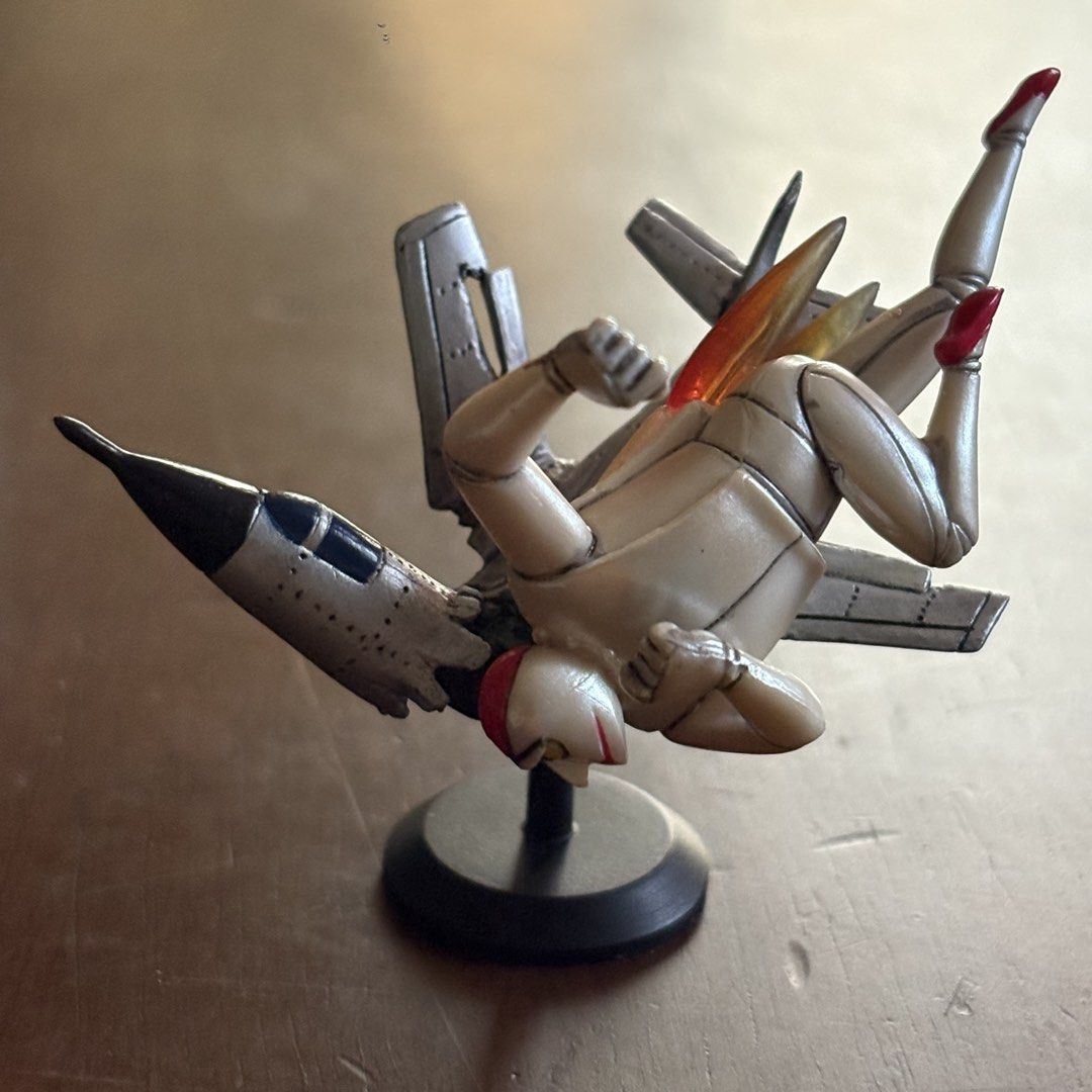 Kaiyodo Retro Robot and Jet Fighter Figure Set (Category: Figurines & Statues) located in Manila. Submitted by aobacafe (Listing ID 1469845920, Image 2). Description: - Authentic Kaiyodo miniature set featuring a retro robot and fighter jet - Includes original blue packaging box and mini booklet - Features detailed paintwork and comes mounted on a black display stand - Great vintage collectible for fans of classic Japanese mecha and aircraft desi