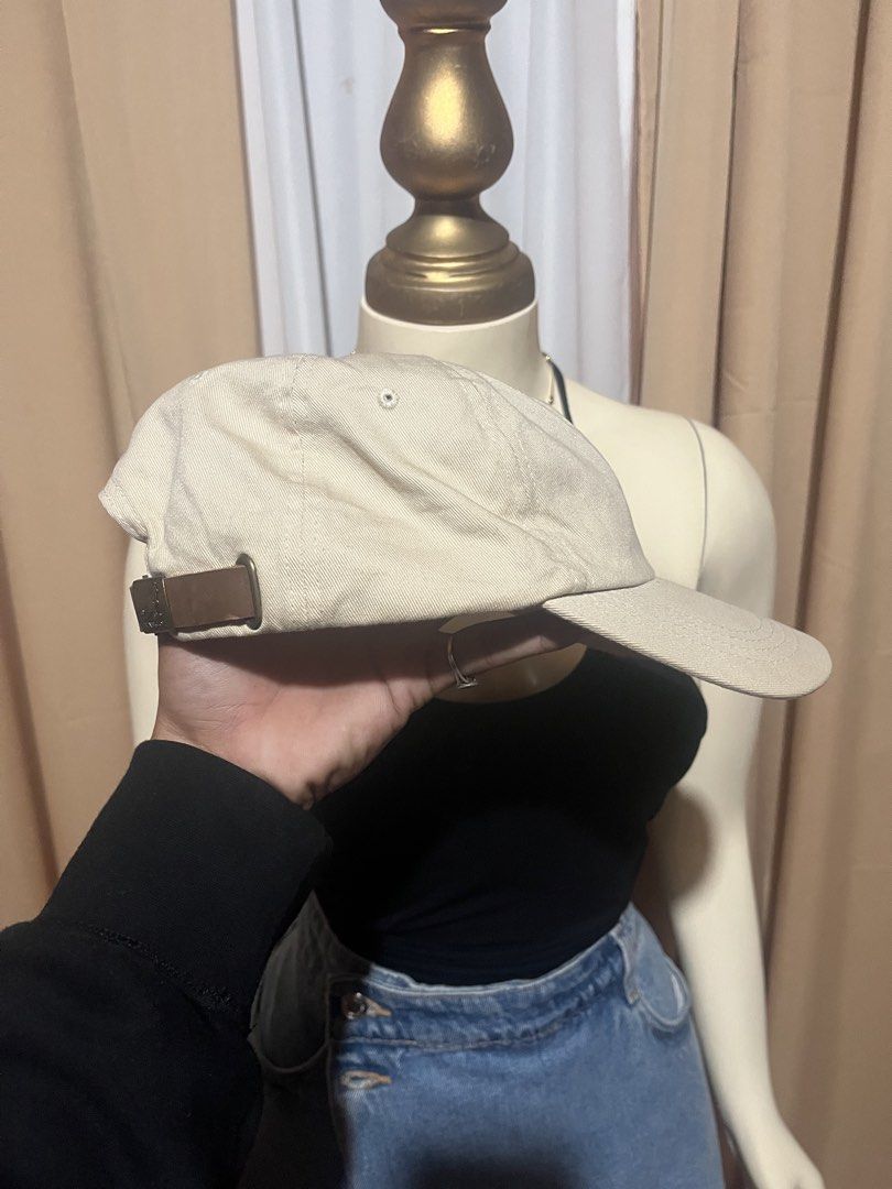 Kangol Beige Baseball Cap with Leather Strap (Category: Caps & Hats) located in Kidapawan. Submitted by azythrift (Listing ID 1469939171, Image 2). Description: - Authentic Kangol baseball cap in classic beige - Iconic embroidered kangaroo logo on the front - Made from durable cotton twill with breathable eyelets - Adjustable brown leather strapback with metallic buckle - Clean interior lining with official branded tag - Versatile everyday access