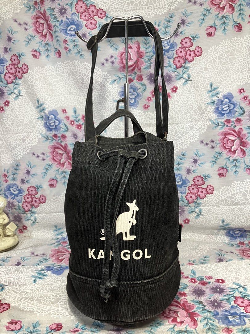 KANGOL BLACK CANVAS DRAWSTRING CROSSBODY/HAND BAG ADJUSTABLE STRAP (Category: Cross-body Bags) located in General Mariano Alvarez. Submitted by adonid (Listing ID 1469819057, Image 1). Description: KANGOL BLACK CANVAS DRAWSTRING CROSSBODY/HAND BAG ADJUSTABLE STRAP GOOD CONDITION NORMAL SIGN OD USAGE ONLY .