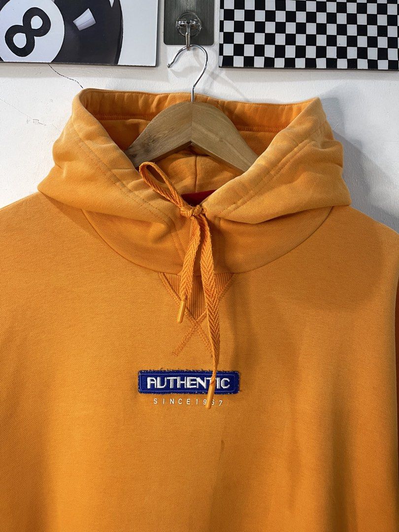 Kappa Authentic Since 1967 Orange Hoodie (Category: Coats, Jackets and Outerwear) located in Cabagan. Submitted by blessingma81004 (Listing ID 1469770021, Image 3). Description: - Brand: Kappa - Color: Vibrant Orange - Size: XL (Width: 25", Length: 28.5") - Material: Heavyweight cotton blend with ribbed side panels - Features: Chest embroidery, drawstring hood, front kangaroo pocket, and sleeve logo patch - Condition: Excellent pre-loved conditio