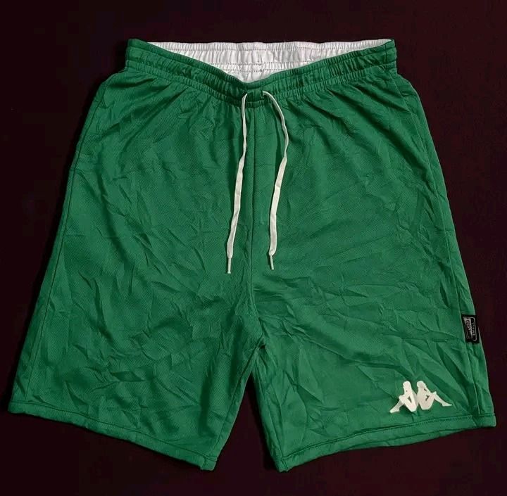 Kappa Reversible Athletic Shorts White Green (Category: Shorts) located in Cebu City. Submitted by badat23 (Listing ID 1469937200, Image 2). Description: - Brand: Kappa - Style: Reversible athletic shorts - Side A: White with green trim and green logo - Side B: Solid green with white logo and matching drawstring - Waistband: Comfortable elastic - Ideal for: Workouts, basketball, and casual wear - Condition: Excellent.