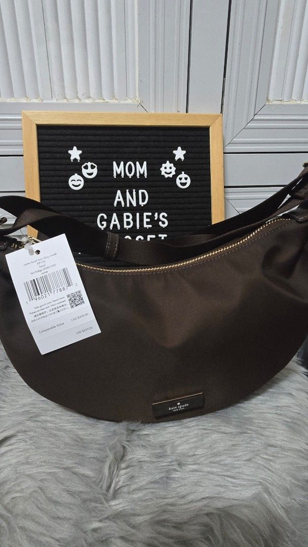 Kate Spade Carter Mini Sling Crossbody Bag Hot Fudge (Category: Cross-body Bags) located in Cabanatuan. Submitted by belle_1013 (Listing ID 1469936607, Image 2). Description: - Brand: Kate Spade - Style: Carter Mini Sling Crossbody Bag - Color: Hot Fudge Brown - Material: Smooth nylon with matching adjustable fabric strap and gold hardware - Closure: Zip top with front metal brand plaque - Condition: Brand new, never used, fresh from store with o
