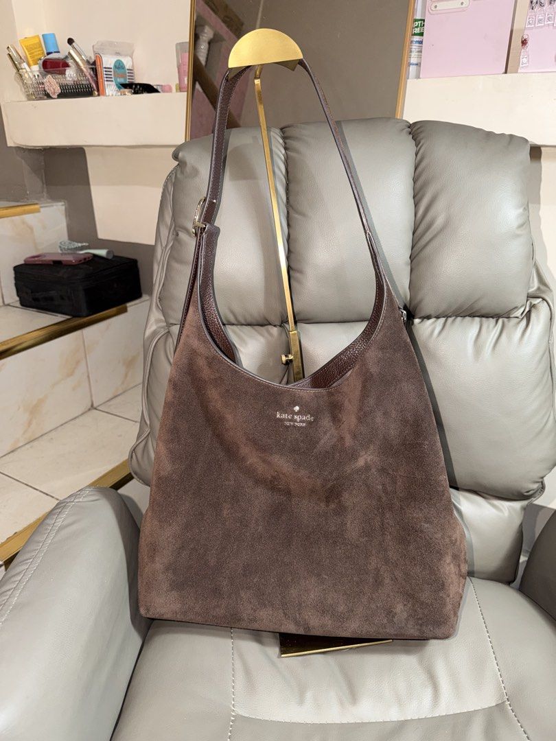 Kate Spade Hot Fudge Suede (Category: Tote Bags) located in Manila. Submitted by pinkkitkat (Listing ID 1469929367, Image 2). Description: Kate Spade 454 Large Bag in Hot Fudge 🤎 * Well taken care of 😊 * 9.5/10 condition * Authentic, gifted to me from the US 🇺🇸 * Meetups around Makati, by schedule * Located in Tondo, Manila 📍 * Lalamove/Grab ready 🚗 PM for inquiries! 💌.