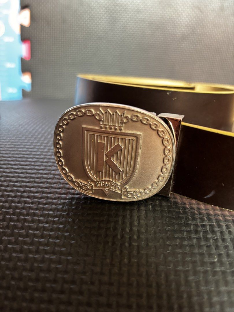 KENZO Logo Buckle Leather Belt (Category: Belts) located in Caloocan City. Submitted by neweagle-424b (Listing ID 1469812344, Image 2). Description: ( 43 ) - inches length - Brand: KENZO - Color: Dark Brown - Material: Genuine Leather - Hardware: Silver-tone crest buckle with 'K' initial - Details: Embossed branding and serial numbers on the inner strap - Style: Classic and versatile for casual or formal wear - Condition: Sturdy and well-maintain