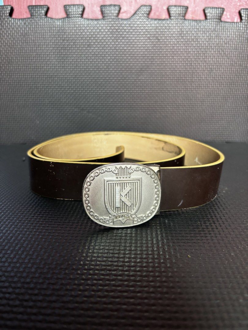 KENZO Logo Buckle Leather Belt (Category: Belts) located in Caloocan City. Submitted by neweagle-424b (Listing ID 1469812344, Image 1). Description: ( 43 ) - inches length - Brand: KENZO - Color: Dark Brown - Material: Genuine Leather - Hardware: Silver-tone crest buckle with 'K' initial - Details: Embossed branding and serial numbers on the inner strap - Style: Classic and versatile for casual or formal wear - Condition: Sturdy and well-maintain