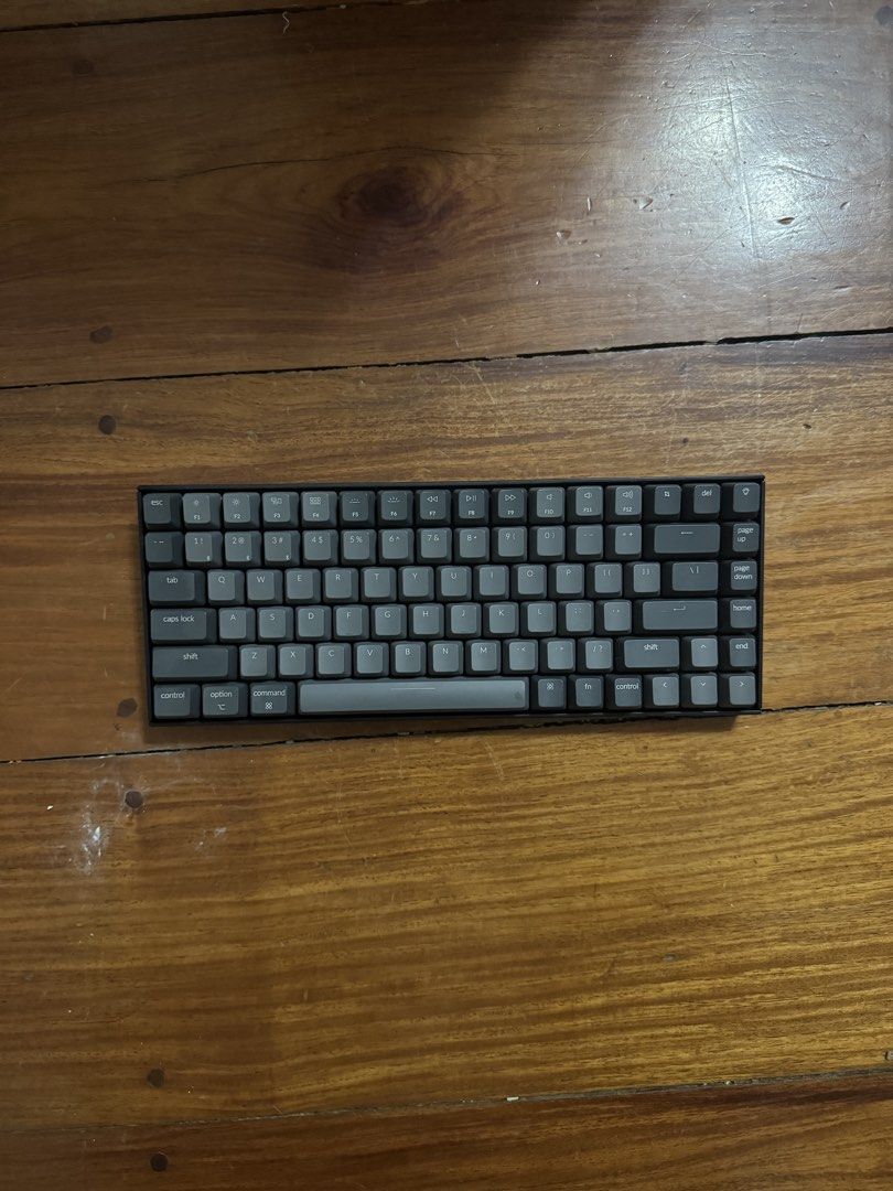 Keychron K2 Wireless Mechanical Keyboard (Category: Computer Keyboard) located in Manila. Submitted by jaggylejano (Listing ID 1469871004, Image 1). Description: - Model: Keychron K2 Wireless Mechanical Keyboard (Dark Grey) - Layout: Compact 75% with Mac modifier keycaps currently installed - Connectivity: Dual mode (Bluetooth wireless and wired USB-C) - Features: Side toggle switches for OS mode and connection, sturdy plastic frame, and adjustab