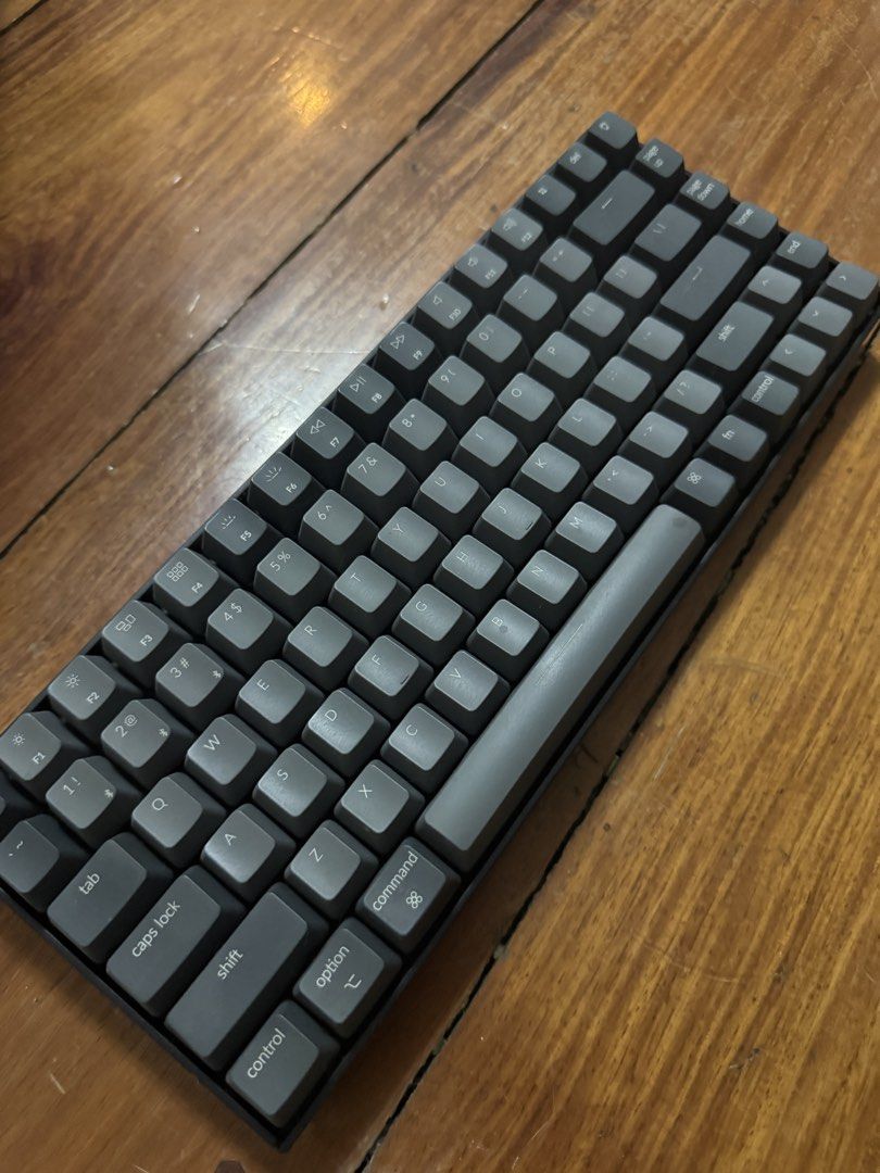 Keychron K2 Wireless Mechanical Keyboard (Category: Computer Keyboard) located in Manila. Submitted by jaggylejano (Listing ID 1469871004, Image 2). Description: - Model: Keychron K2 Wireless Mechanical Keyboard (Dark Grey) - Layout: Compact 75% with Mac modifier keycaps currently installed - Connectivity: Dual mode (Bluetooth wireless and wired USB-C) - Features: Side toggle switches for OS mode and connection, sturdy plastic frame, and adjustab