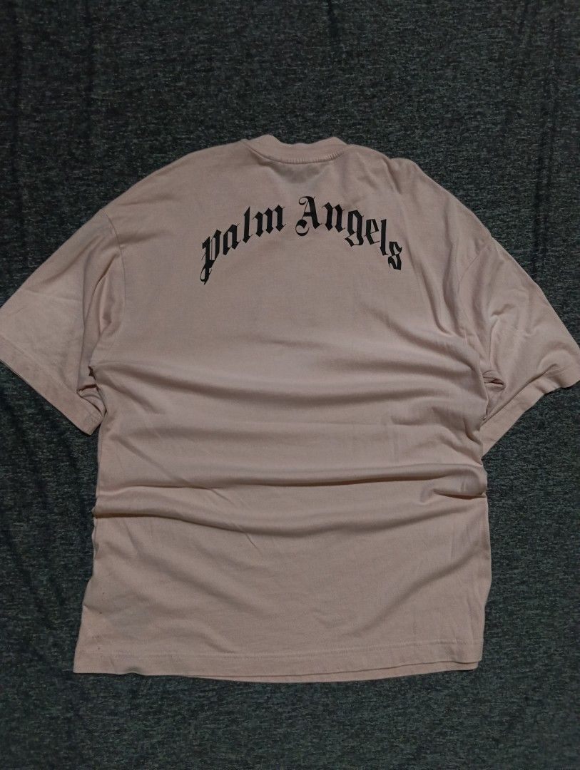Kimjustine Inayan (Category: Formal Shirts) located in Manila. Submitted by kim_inayan (Listing ID 1469768051, Image 2). Description: PALM ANGELS TSHIRT MASIKIP YUNG NECK SOLID SIZE: LARGE TO XL L30 W20 EXCELLENT CONDITIONS ISSUES: DOT STAIN WASHED 300+SF ONLY.
