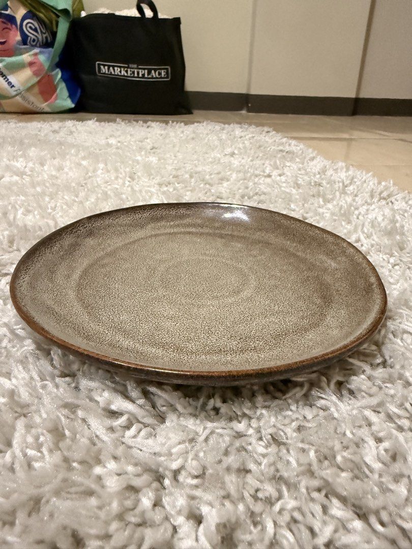 Kitchen Plus Ceramic Plate Brown Speckled (Category: Dinnerware & Cutlery) located in Mandaluyong City. Submitted by riz_040521 (Listing ID 1469798215, Image 1). Description: - Brand: Kitchen Plus - Material: Heavyweight ceramic - Design: Brown with speckled glaze and dark rim - Size: Standard dinner plate - Condition: Great for everyday use, authentic bottom stamp visible -3 for 350.