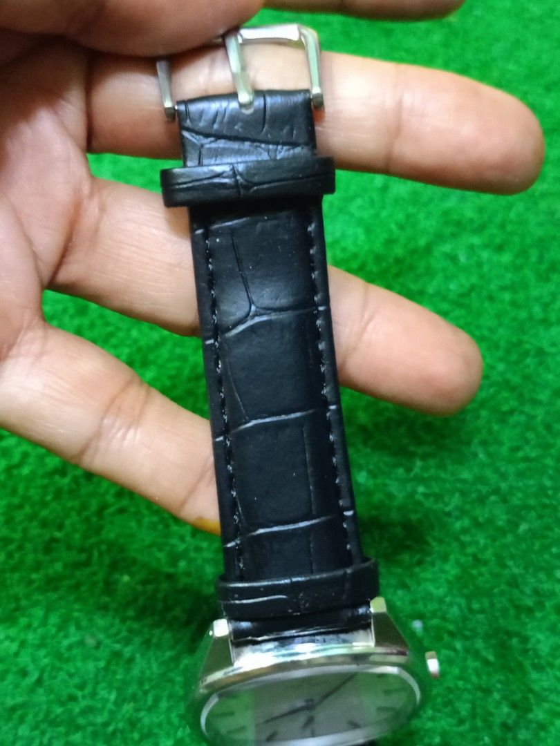 Knut Gadd Stockholm Watch (Category: Men's Watches) located in Bacoor. Submitted by bibelot03 (Listing ID 1469939310, Image 3). Description: - Brand/Model: Knut Gadd Stockholm Men's Dress Watch - Dial: White textured dial with silver hands, index markers, and small seconds sub-dial - Case: Silver-toned with a unique cushion shape and clean crystal - Strap: Black leather with embossed crocodile pattern and standard pin buckle - Condition: Nice ove
