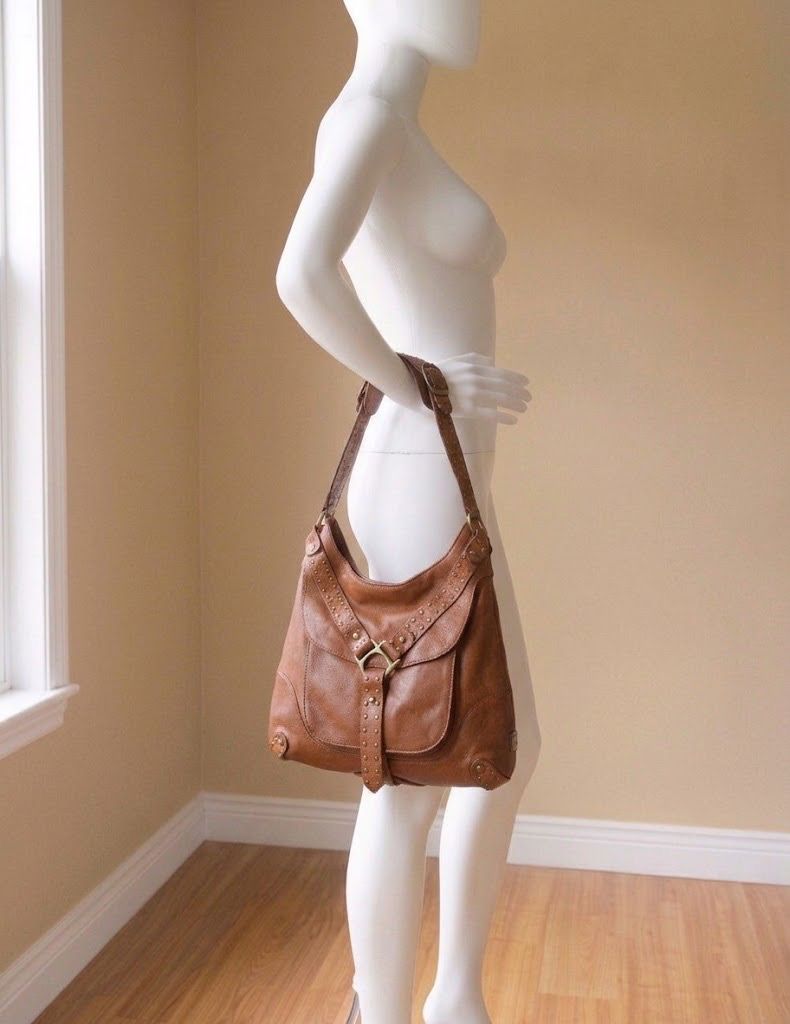 KOOBA USA STUDDED BROWN BAG (Category: Shoulder Bags) located in Marikina City. Submitted by minimalistmanila (Listing ID 1469903526, Image 1). Description: Genuine Kooba caramel brown shoulder bag purchased in Florida USA. Size is M/L. Heavy duty as made from real leather with metal studs. Funky style. Invest in a good heavy duty bag now. Order now!.