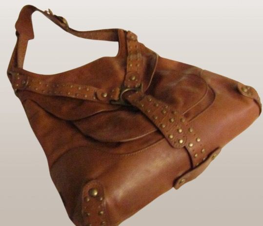 KOOBA USA STUDDED BROWN BAG (Category: Shoulder Bags) located in Marikina City. Submitted by minimalistmanila (Listing ID 1469903526, Image 3). Description: Genuine Kooba caramel brown shoulder bag purchased in Florida USA. Size is M/L. Heavy duty as made from real leather with metal studs. Funky style. Invest in a good heavy duty bag now. Order now!.