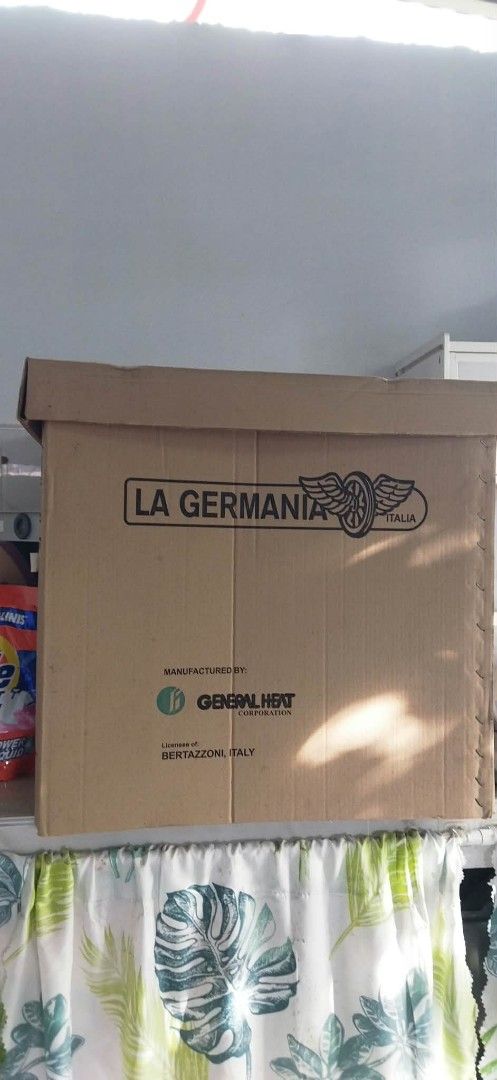 La Germania SL100 10B Electric Oven (Category: Ovens & Toasters) located in Manila. Submitted by charieeris13732 (Listing ID 1469833634, Image 1). Description: - Brand: La Germania (Model SL100 10B) - Color/Design: Sleek black finish with glass door - Features: Built-in temperature conversion chart on side control panel - Inclusions: Wire rack, product manual, and original box - Manufacturer: General Heat Corporation (under license from Bertazzon
