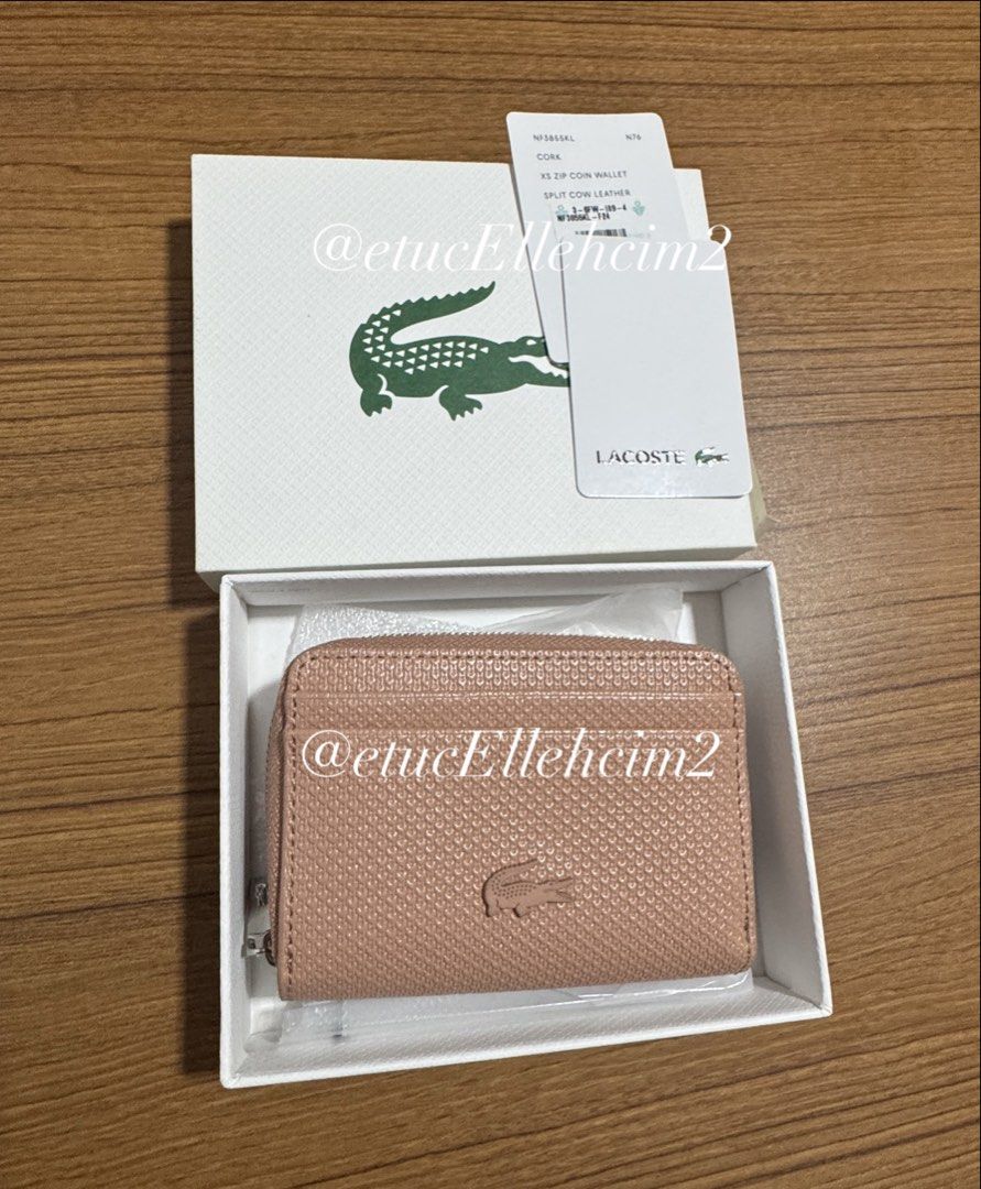 Lacoste Cork XS Zip Coin Wallet (Category: Wallets & Card holders) located in Pasay City. Submitted by michmonteros (Listing ID 1469870680, Image 1). Description: PRELOVED - 100% Brand new with original box and tags attached - Premium split cow leather with a stylish textured finish in cork color - Convenient XS size with multiple card slots inside and outside - Secure zippered main closure to keep your essentials safe - Trusted Carousell seller,