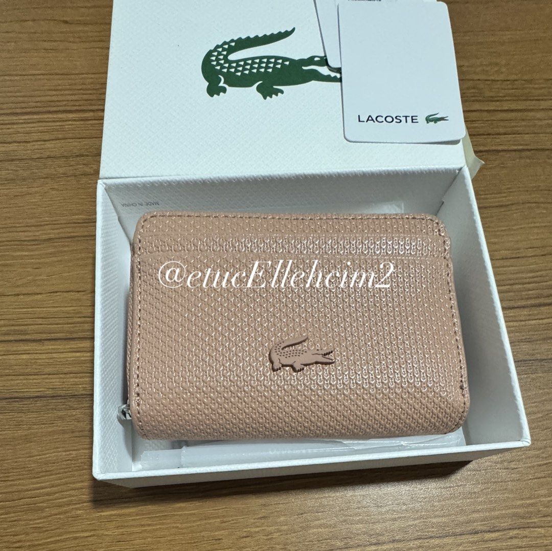 Lacoste Cork XS Zip Coin Wallet (Category: Wallets & Card holders) located in Pasay City. Submitted by michmonteros (Listing ID 1469870680, Image 2). Description: PRELOVED - 100% Brand new with original box and tags attached - Premium split cow leather with a stylish textured finish in cork color - Convenient XS size with multiple card slots inside and outside - Secure zippered main closure to keep your essentials safe - Trusted Carousell seller,