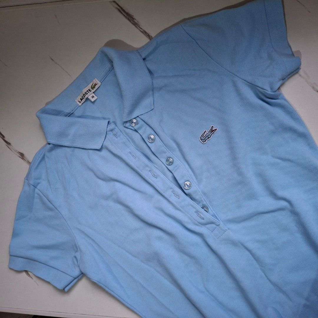 Lacoste Light Blue Polo Shirt (Category: Others Tops) located in Caloocan City. Submitted by mei56313 (Listing ID 1469878595, Image 1). Description: - preloved Lacoste polo shirt (authentic) - size 36/S loc: Caloocan City MOP: BPI/Gcash MOD: J&T (sf c/o buyer).