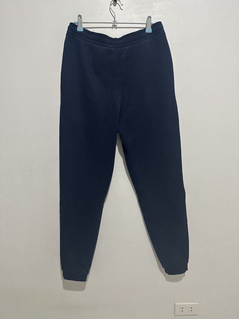 Lacoste Men’s Navy Blue Sweatpants (Category: Joggers) located in Cainta. Submitted by xyzasisa (Listing ID 1469947207, Image 2). Description: - Brand: Lacoste - Color: Navy blue - Size: FR 3 / US S - Fit: Tapered - Material: Soft cotton blend - Details: Classic embroidered crocodile logo near the left pocket, elastic waistband with drawstring closure - Condition/Use: Great everyday piece for lounging or running errands.