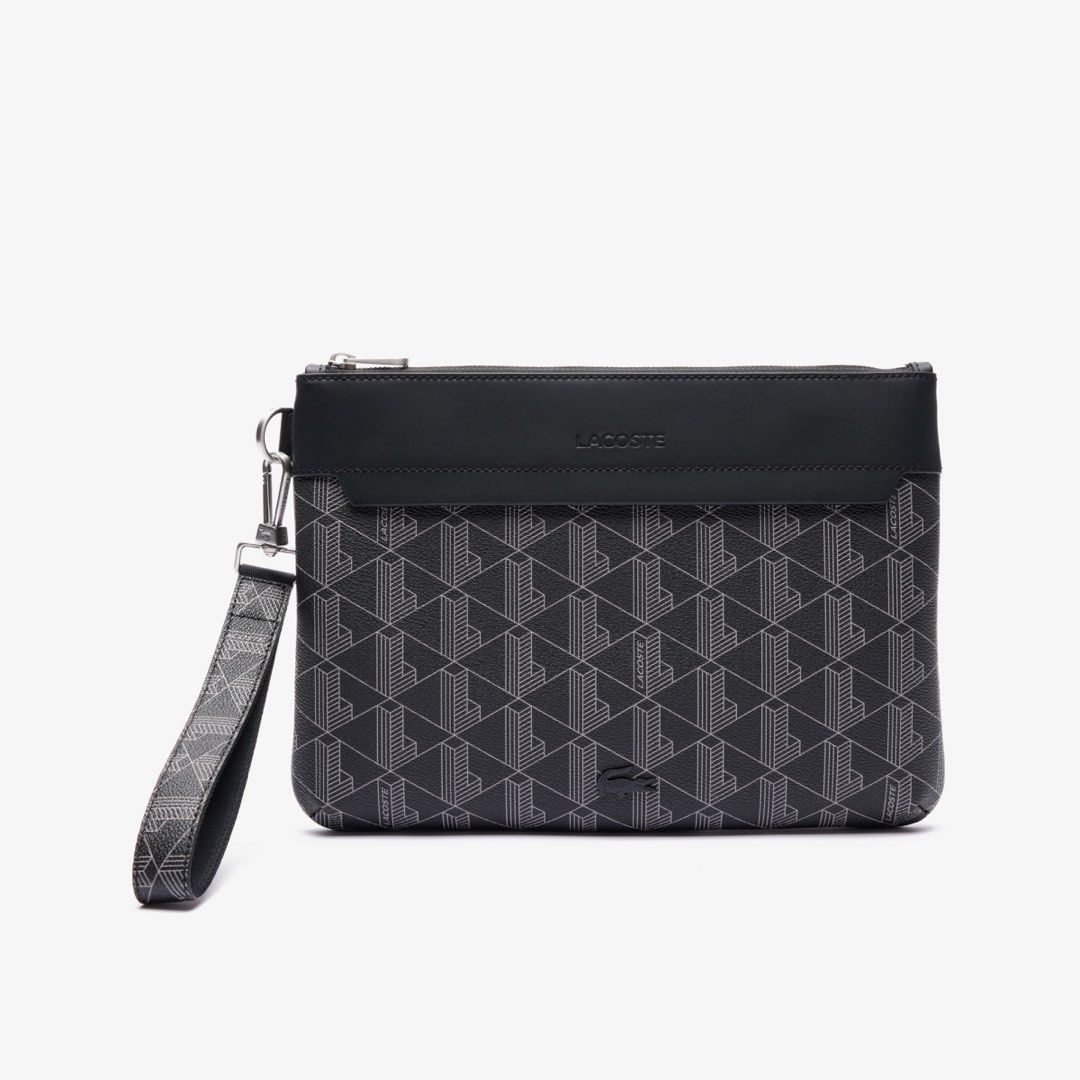 Lacoste Bag (Category: Belt bags, Clutches and Pouches) located in Muntinlupa City. Submitted by johnmichel (Listing ID 1469903850, Image 1). Description: - Condition: Brand new with Receipt - Brand: Lacoste - Color: Black with all-over geometric monogram pattern - Closure: Secure zip-top closure - Strap: Includes a detachable matching wrist strap .
