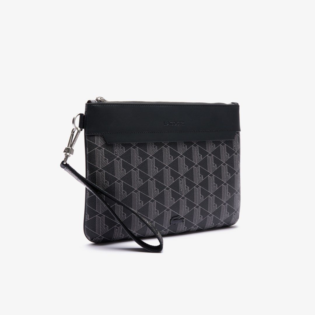 Lacoste Bag (Category: Belt bags, Clutches and Pouches) located in Muntinlupa City. Submitted by johnmichel (Listing ID 1469903850, Image 2). Description: - Condition: Brand new with Receipt - Brand: Lacoste - Color: Black with all-over geometric monogram pattern - Closure: Secure zip-top closure - Strap: Includes a detachable matching wrist strap .