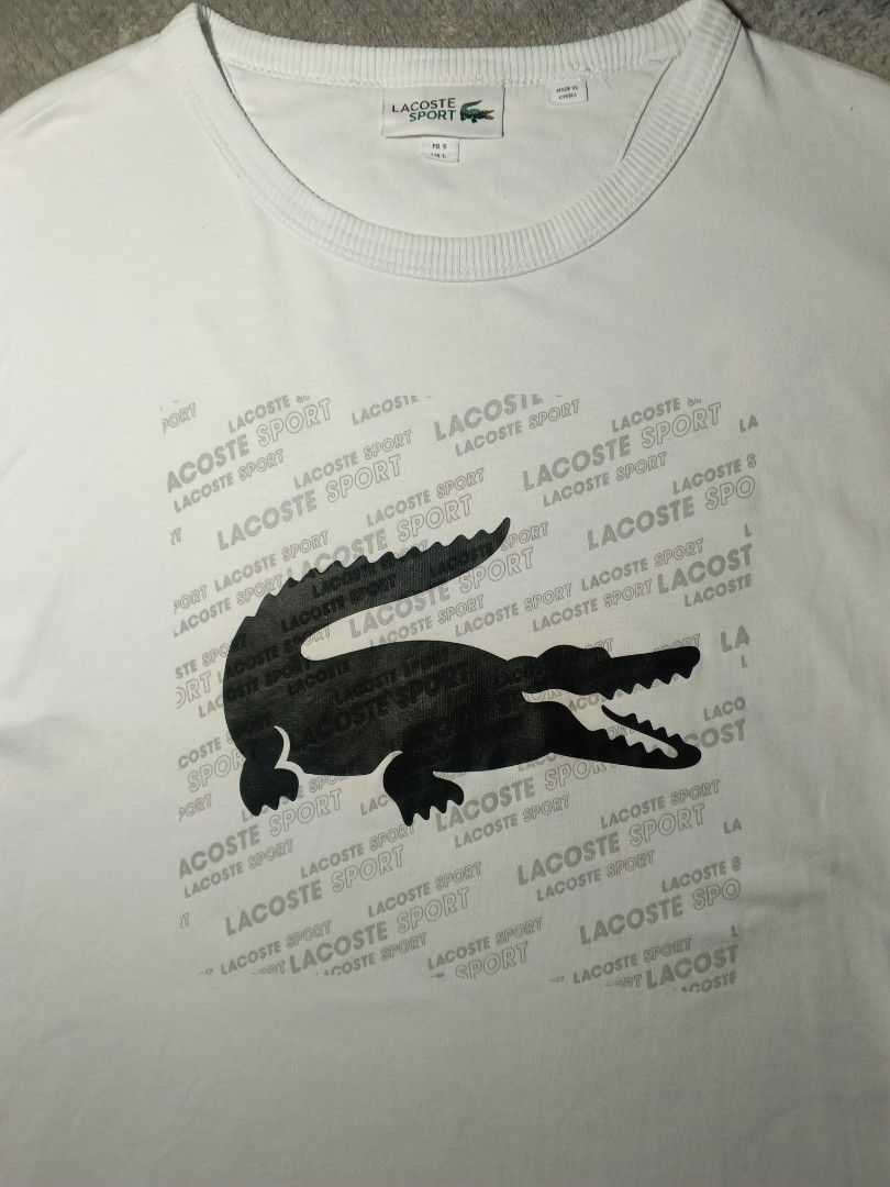 Lacoste T-shirt (Category: Tshirts & Polo Shirts ) located in Cebu City. Submitted by authenticgrids (Listing ID 1469887559, Image 2). Description: Lacoste T-shirt Lacoste Big 🐊 Logo Print Excellent/Like New Condition ✨ Issue/s: None 💯 Size on Tag 🏷️ FR 5 US L Dimensions Width 23 inches Length 30 inches 📥📥📥📥📥 DM us for more details ☺️.