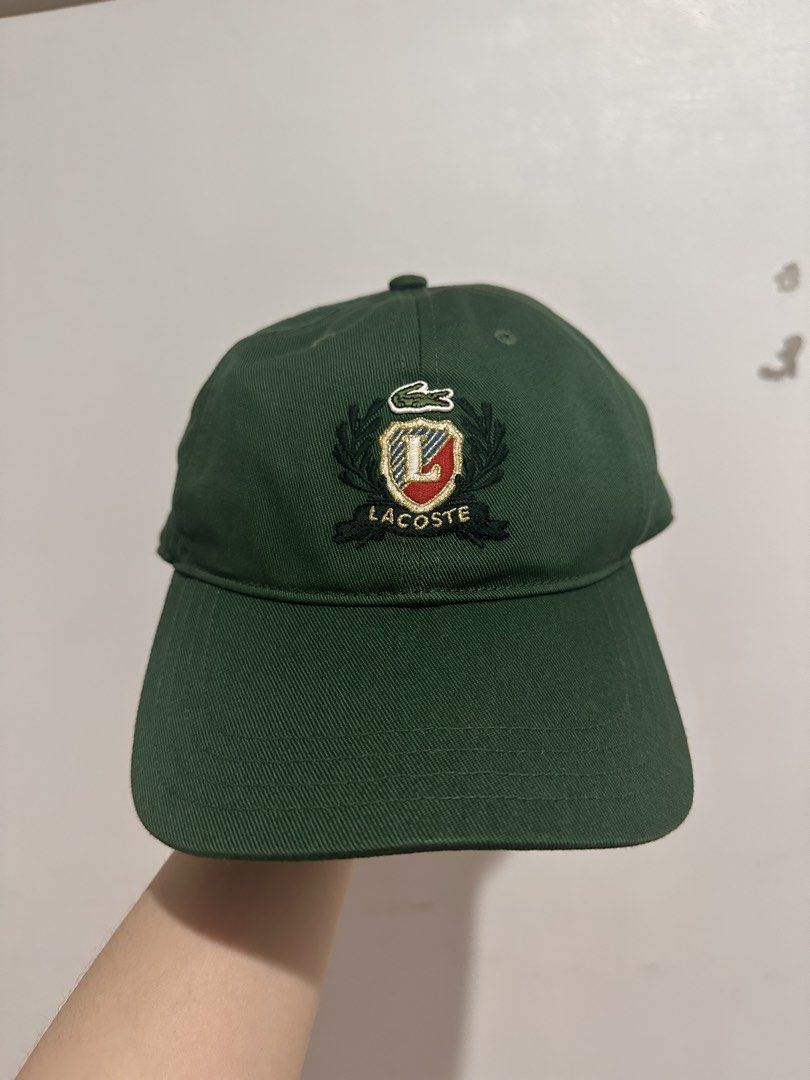 Lacoste Unisex Embroidered Twill Cap (Category: Caps & Hats) located in Cainta. Submitted by xyzasisa (Listing ID 1469905864, Image 1). Description: - Brand: Lacoste - Color: Green - Design: Embroidered front crest logo with 'L' and brand name - Closure: Adjustable strap back with debossed crocodile buckle - Details: Branded interior seam taping - Size: One size fits most.