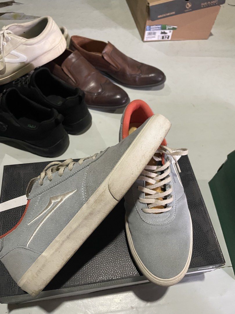 Lakai Grey x Nathaniel Russell (Category: Sneakers) located in Davao. Submitted by houkaygoods (Listing ID 1469890721, Image 2). Description: - Style: Classic low-top skate shoes - Color: Light grey suede with bright orange inner lining and beige laces - Accents: Stylish gold detailing near the collar - Soles: White rubber outsoles with standard grip tread (shows minor dirt marks from previous wear) - Condition: Pre-loved, well-maintained, and fu