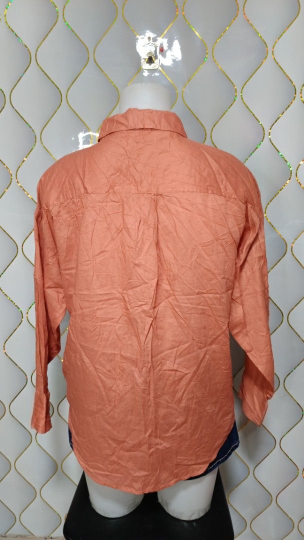 lativ Cotton Button-Up Shirt (Category: Shirts) located in Manila. Submitted by zariyah.1986 (Listing ID 1469811410, Image 2). Description: - Brand: Lativ - Color: Rust - Size: Small - Material: 100% Cotton - Design: Classic collar, front button closure, and long sleeves with button cuffs - Style: Casual basic top, easy to pair with jeans or trousers.